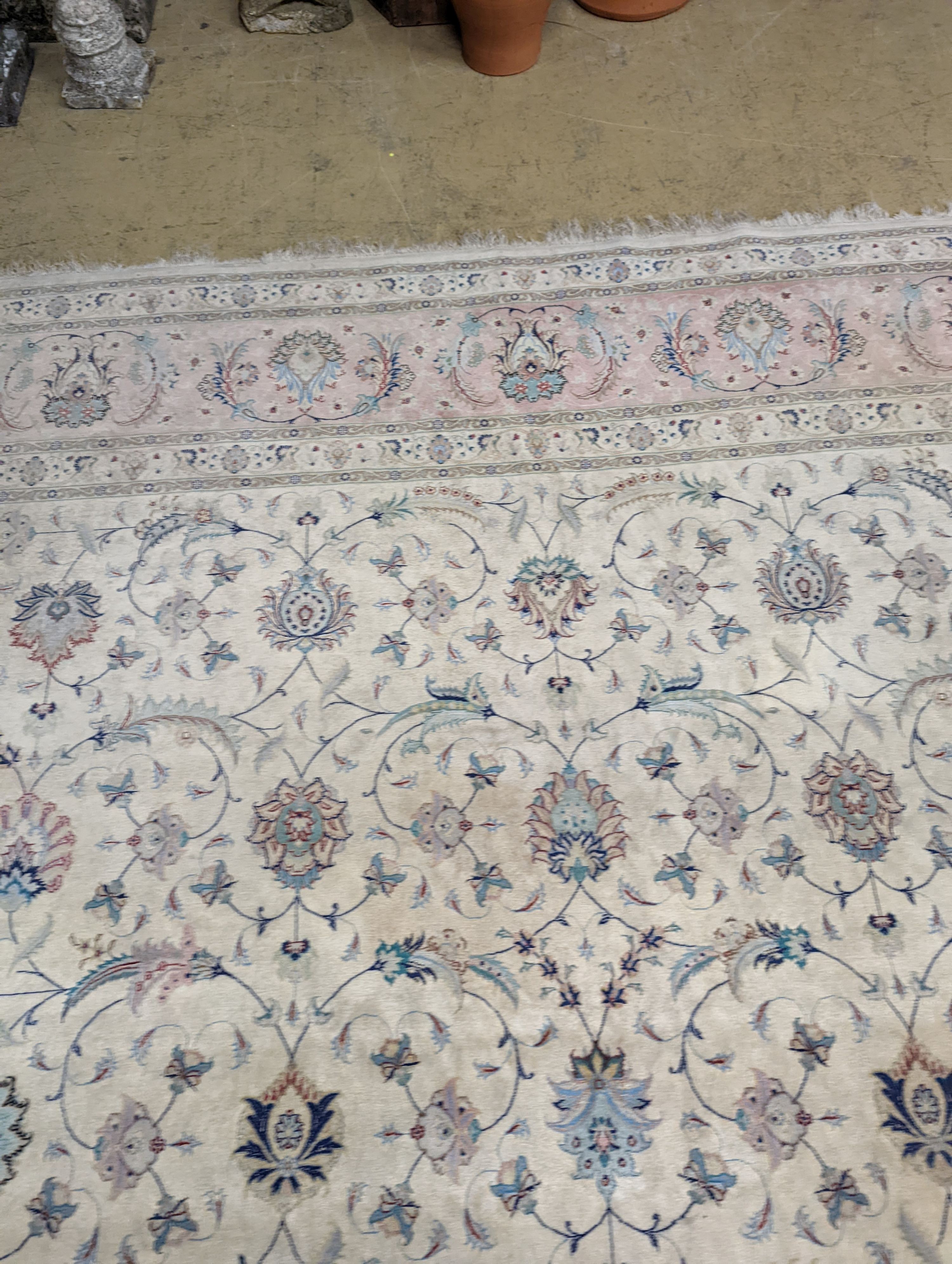 A Persian Tabriz ivory ground carpet, 410 x 300